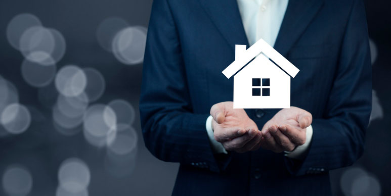 Photo of Business Man holding a house icon